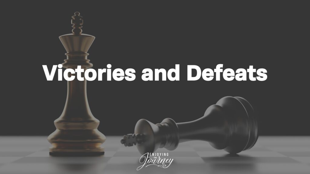 Two king chess pieces, one standing and one falling