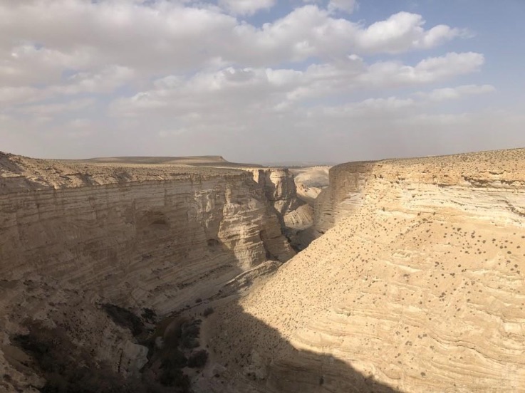The word for wilderness is “meedbar,” (מדבר). This word is spelled exactly the same in the Hebrew text as “he speaks, or I speak.” He speaks/I speak is written the same (מדבר) but pronounced differently “meh-dah-ber.” Ancient readers of the Hebrew Bible saw these words and linked them in their minds. Therefore, the wilderness must be the place where He speaks to you. The spectacular cliffs of Sede Boger in the south of Israel near Beersheba. It has been identified by some scholars with the Wilderness of Zin, which is mentioned in several places in Numbers and Deuteronomy. It is a popular destination for modern hikers and climbers. Photo by John Buckner