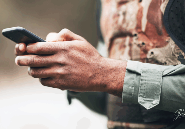 Image of a man on a phone for an article detailing: There is a war going on all around us. This war takes place on the “digital battlefield", composed of the screens that we see every day.