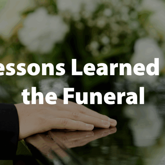 Image of a hand on a casket for an article on Ecclesiastes reveals lessons learned at the funeral. Not the nursery or the wedding ceremony, but at the graveyard, in seasons of mourning.