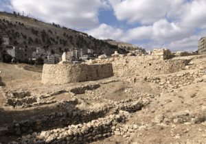 Ancient Shechem, with the mountains Ebal and Gerizim in the background, as well as modern Nablus in the West Bank. Photo by author.