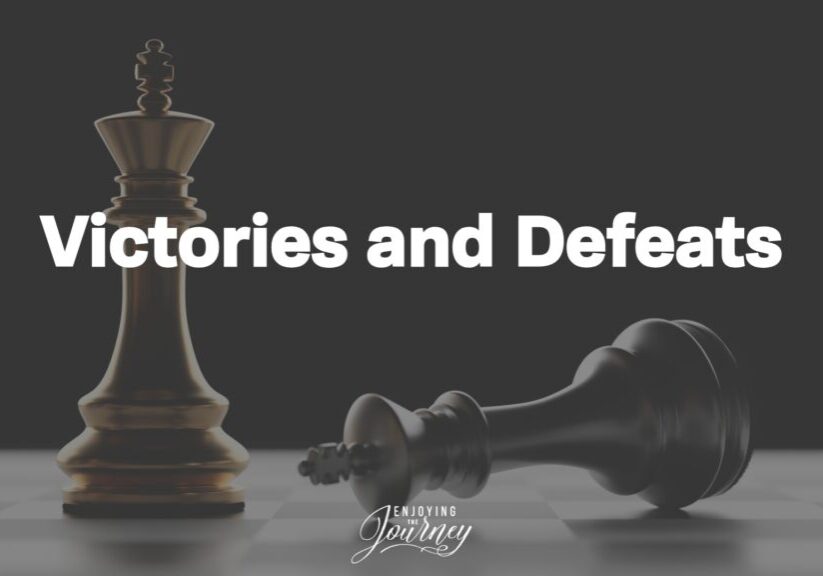 Two king chess pieces, one standing and one falling
