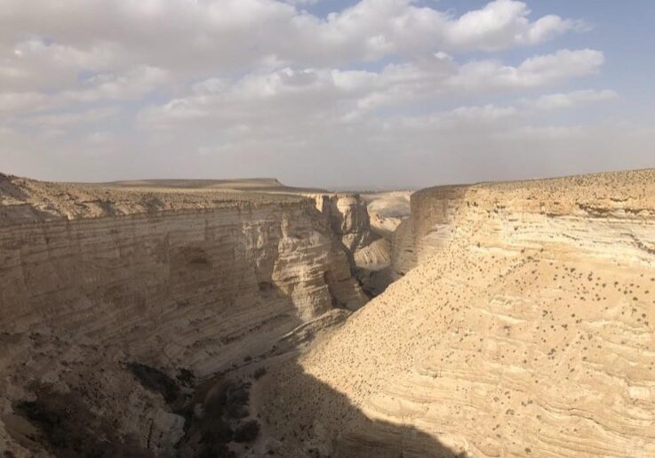 The word for wilderness is “meedbar,” (מדבר). This word is spelled exactly the same in the Hebrew text as “he speaks, or I speak.” He speaks/I speak is written the same (מדבר) but pronounced differently “meh-dah-ber.” Ancient readers of the Hebrew Bible saw these words and linked them in their minds. Therefore, the wilderness must be the place where He speaks to you. The spectacular cliffs of Sede Boger in the south of Israel near Beersheba. It has been identified by some scholars with the Wilderness of Zin, which is mentioned in several places in Numbers and Deuteronomy. It is a popular destination for modern hikers and climbers. Photo by John Buckner